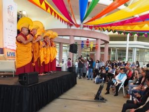 Performers on a stage in front of an audience.